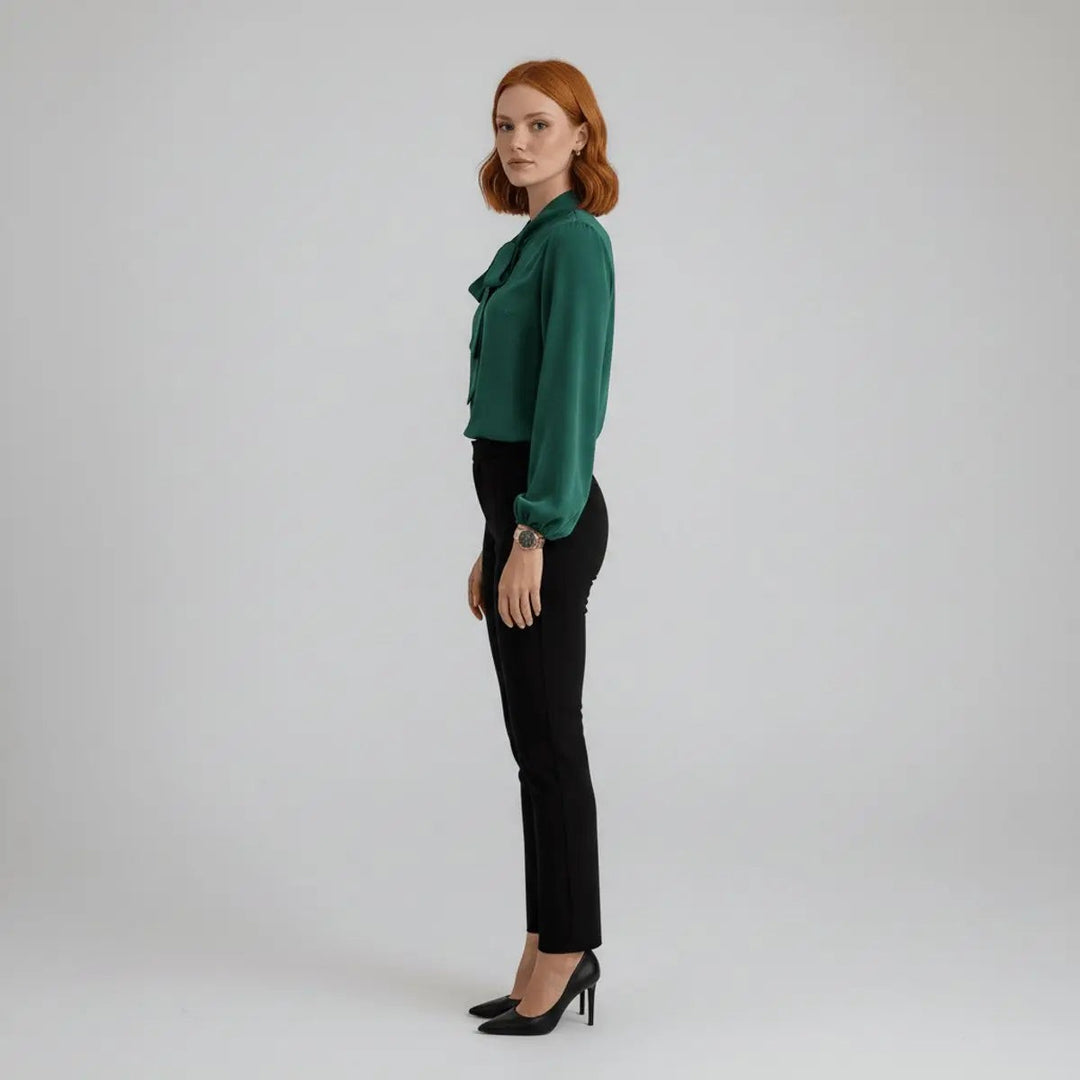 Side view of emerald bow tie blouse with relaxed sleeves