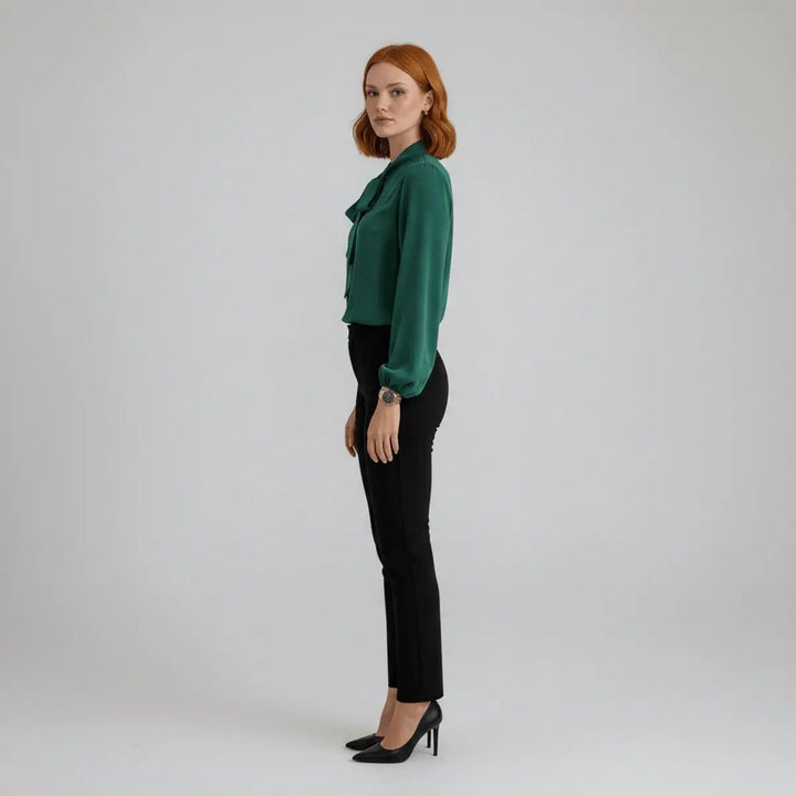 Side view of emerald bow tie blouse with relaxed sleeves