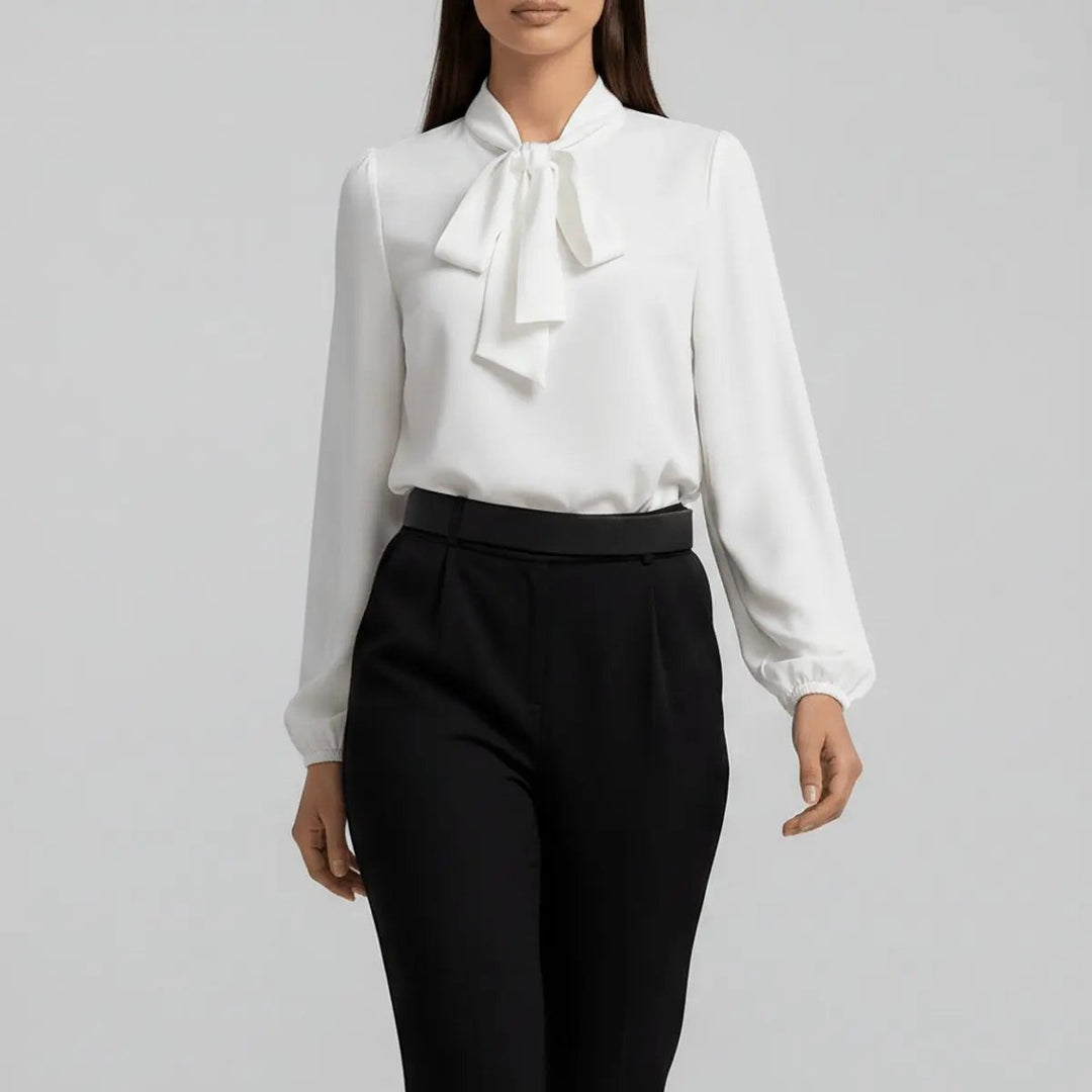 Ivory bow tie neck blouse with balloon sleeves, close-up front view