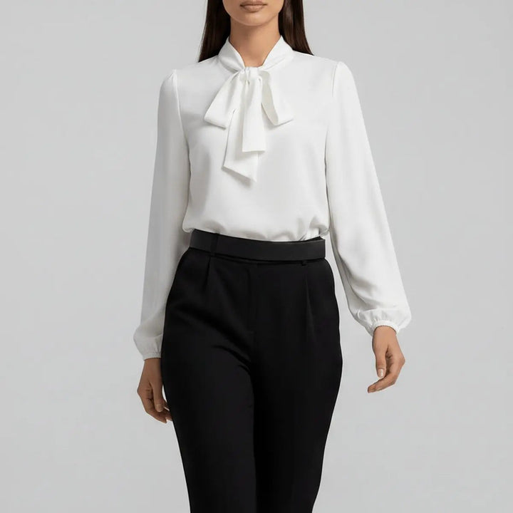 Ivory bow tie neck blouse with balloon sleeves, close-up front view