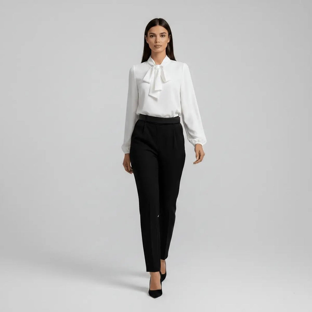 White pussy-bow blouse teamed with black tailored trousers, full outfit