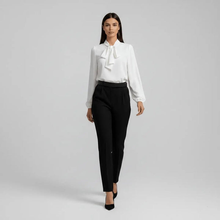 White pussy-bow blouse teamed with black tailored trousers, full outfit