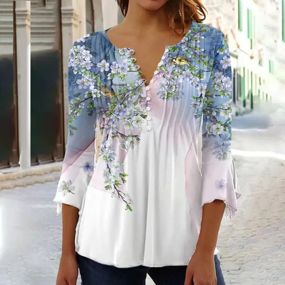 Blue and pink floral henley blouse with bird print and flared cuffs