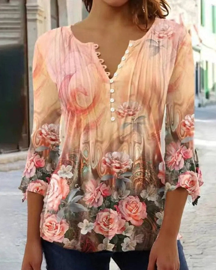 Peach floral henley blouse with watercolour rose print and flared sleeves