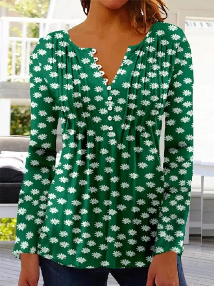 Green henley blouse with white daisy print and long relaxed sleeves