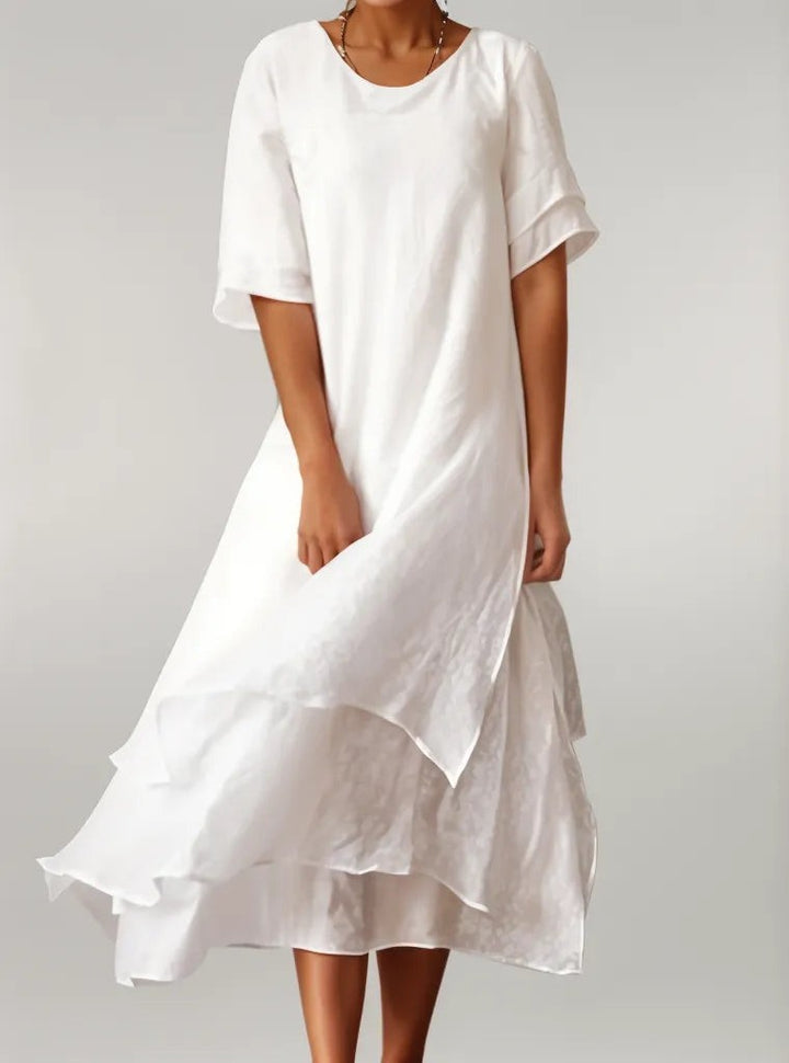 White layered hem midi dress with ruffled tiers and short flutter sleeves