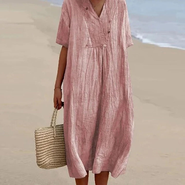Dusky pink textured linen midi dress with short sleeves, beachside look
