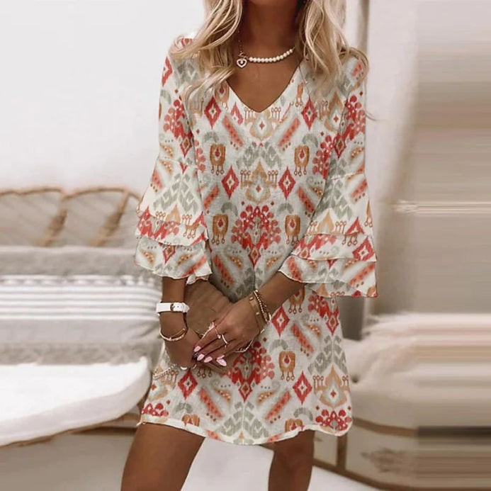 Ikat-print mini dress in coral and grey with ruffled bell sleeves
