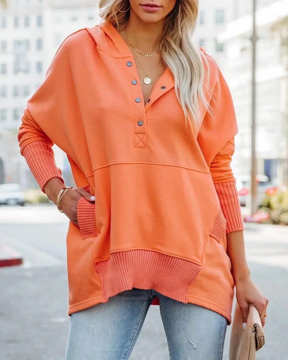 Coral oversized hoodie tunic with ribbed cuffs and front pocket detail