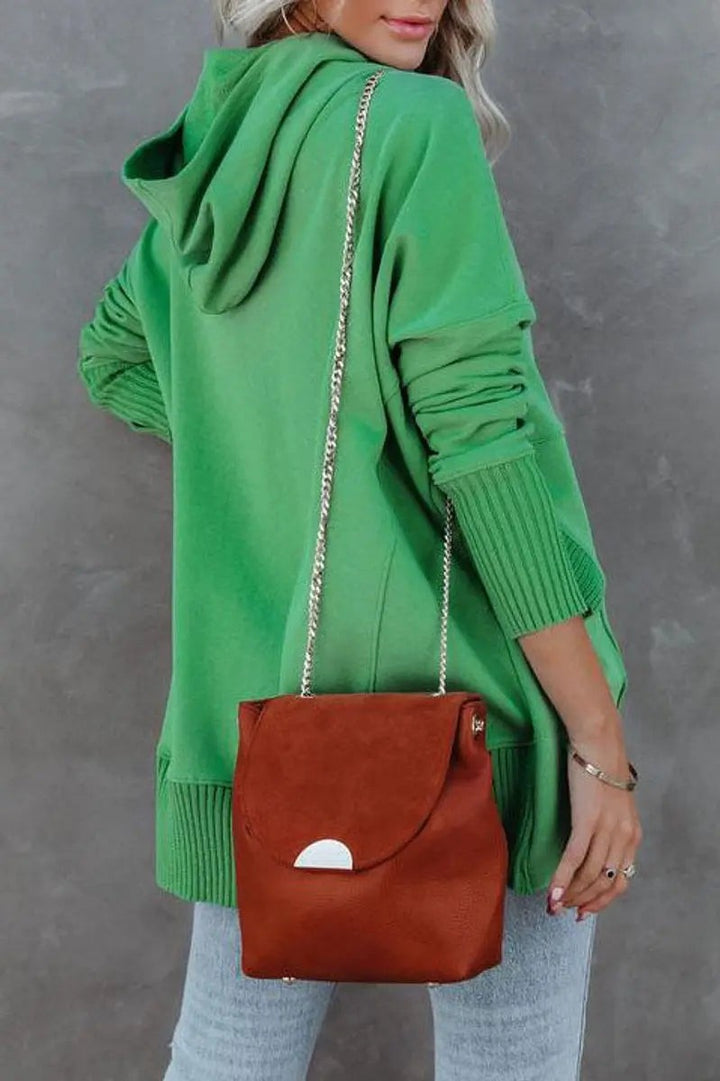 Green oversized hoodie back view with ribbed trims and crossbody bag