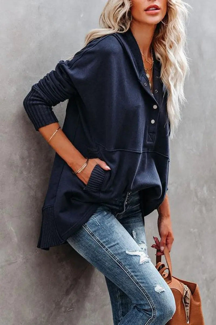 Navy relaxed-fit hoodie tunic styled with distressed skinny jeans