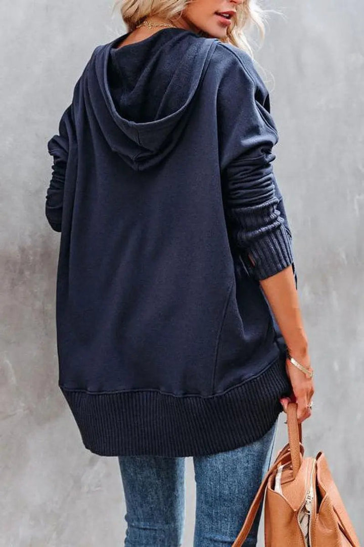 Rear view of navy longline hoodie with ribbed hem detailing