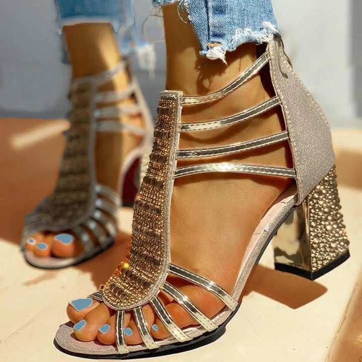 Gold strappy sandal with rhinestone T-bar and studded block heel