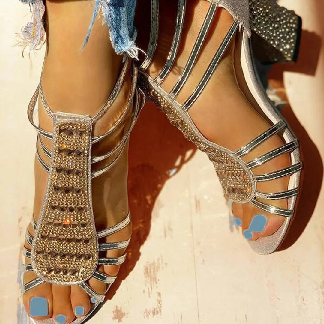 Pair of gold diamante gladiator-style sandals with block heels