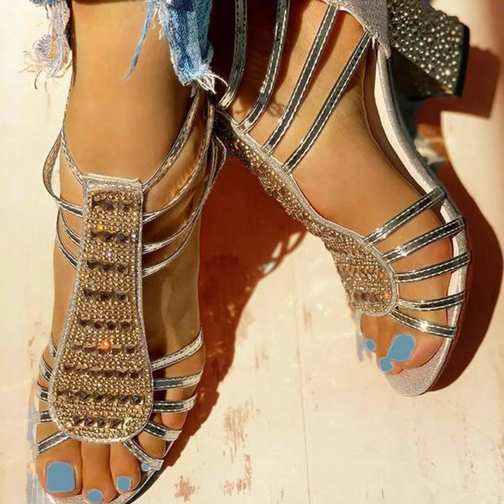Pair of gold diamante gladiator-style sandals with block heels