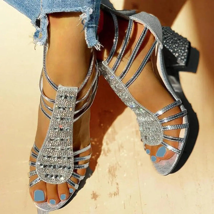 Silver rhinestone gladiator sandals shown from above with block heels