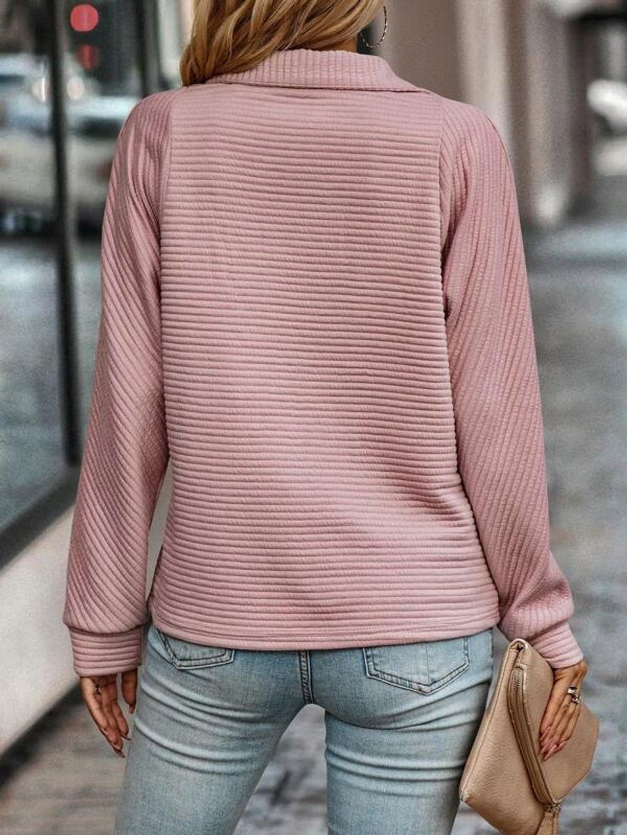 Rear view of pink ribbed quarter-zip pullover showing textured knit back
