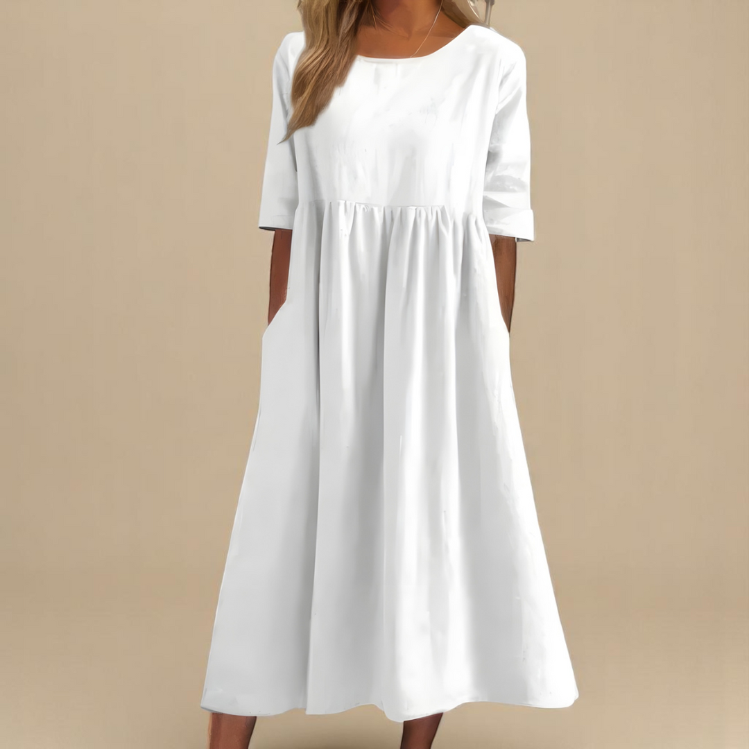 White midi smock dress with round neckline and mid-length sleeves