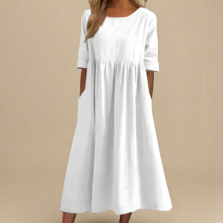 White midi smock dress with round neckline and mid-length sleeves