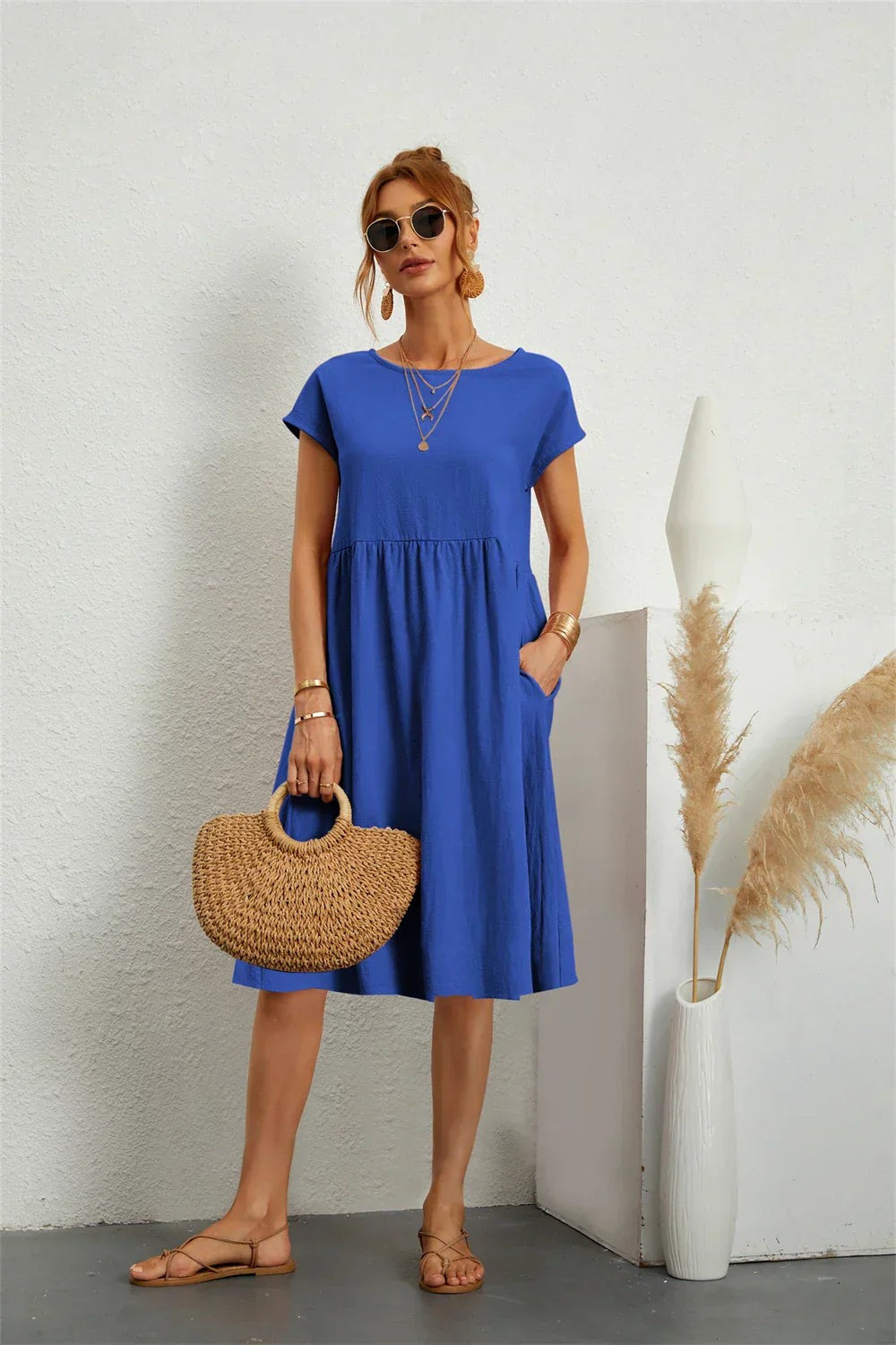 Blue midi dress with short sleeves and relaxed A-line silhouette