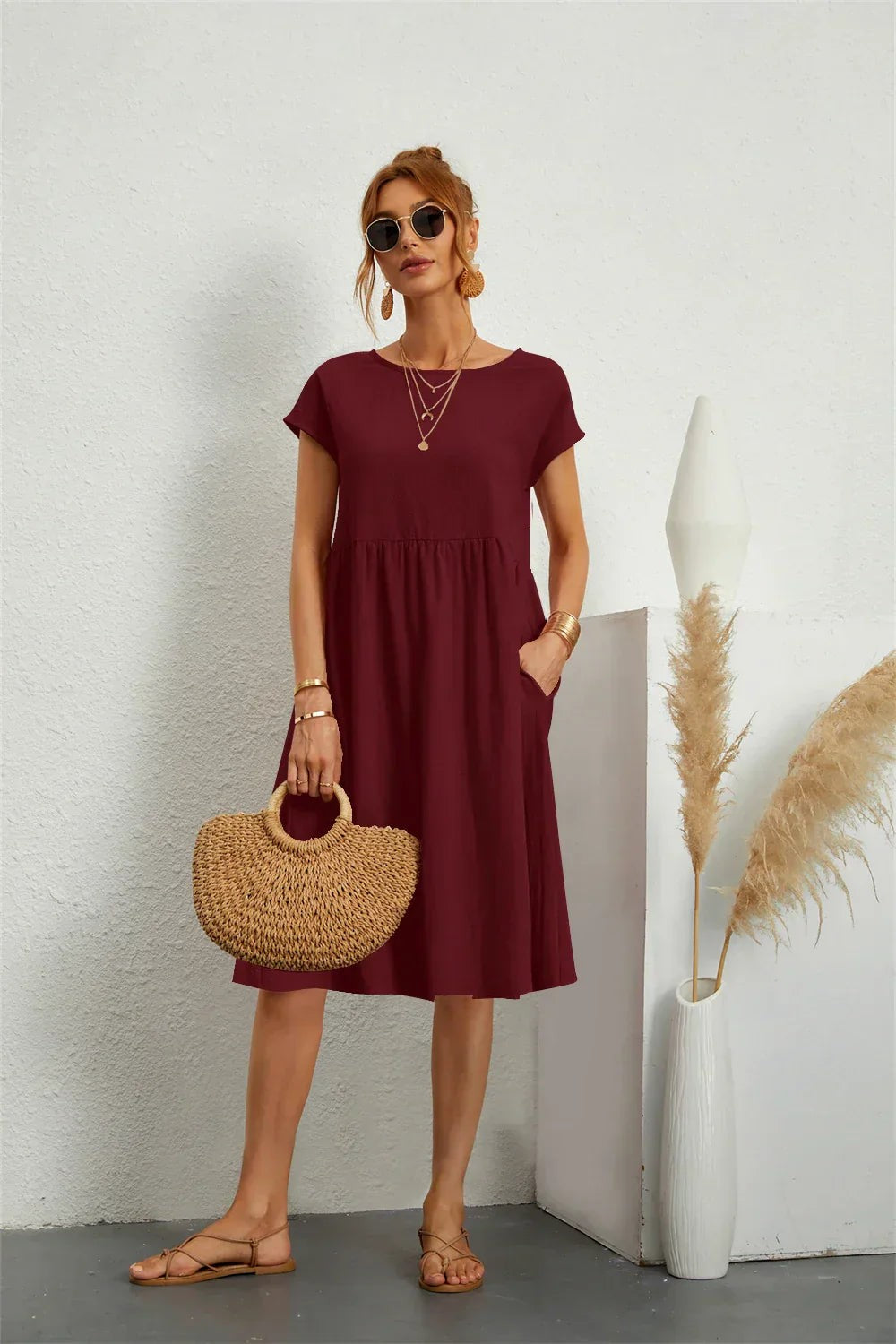 Burgundy midi dress with short sleeves and gathered waist, worn with sandals