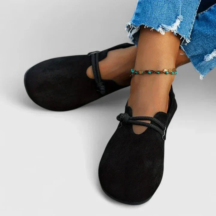 Black suede lace loafers worn with rolled cropped denim jeans