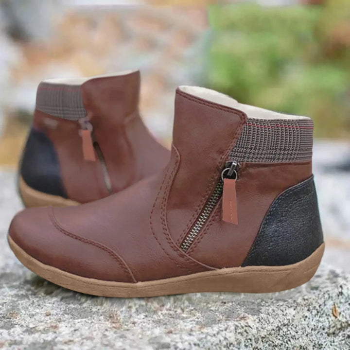 Brown leather ankle boots with contrast heel panel and zip fastening