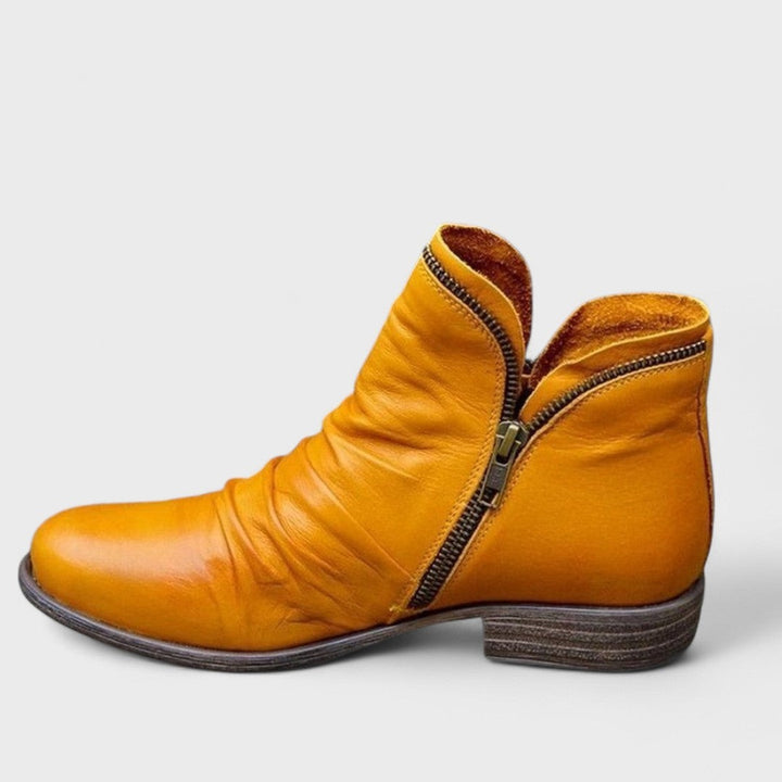 Mustard yellow leather ankle boot with slouch detail and side zip