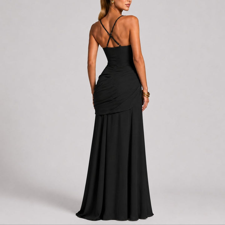 Back view of black ruched maxi dress with crossover straps