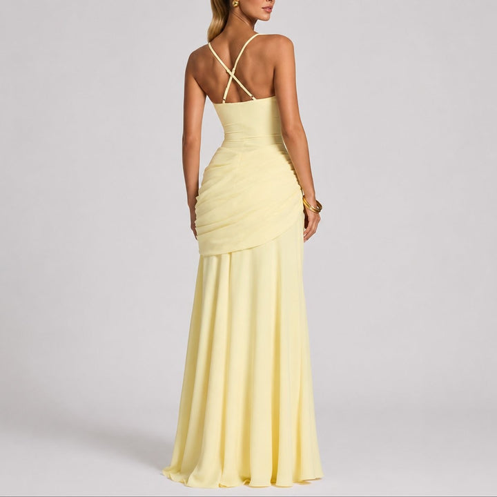 Back detail of yellow maxi dress showing crossover straps and ruching