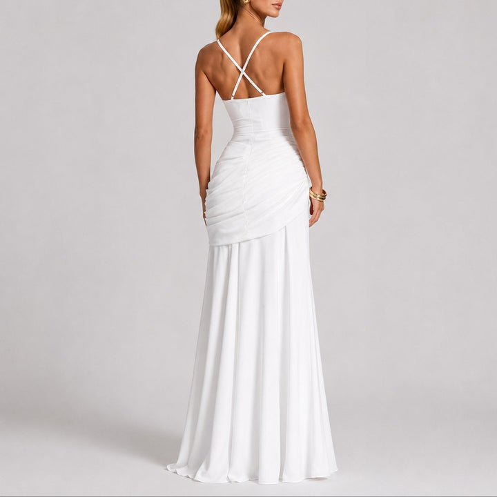 Back view of white ruched gown with crossover straps and train