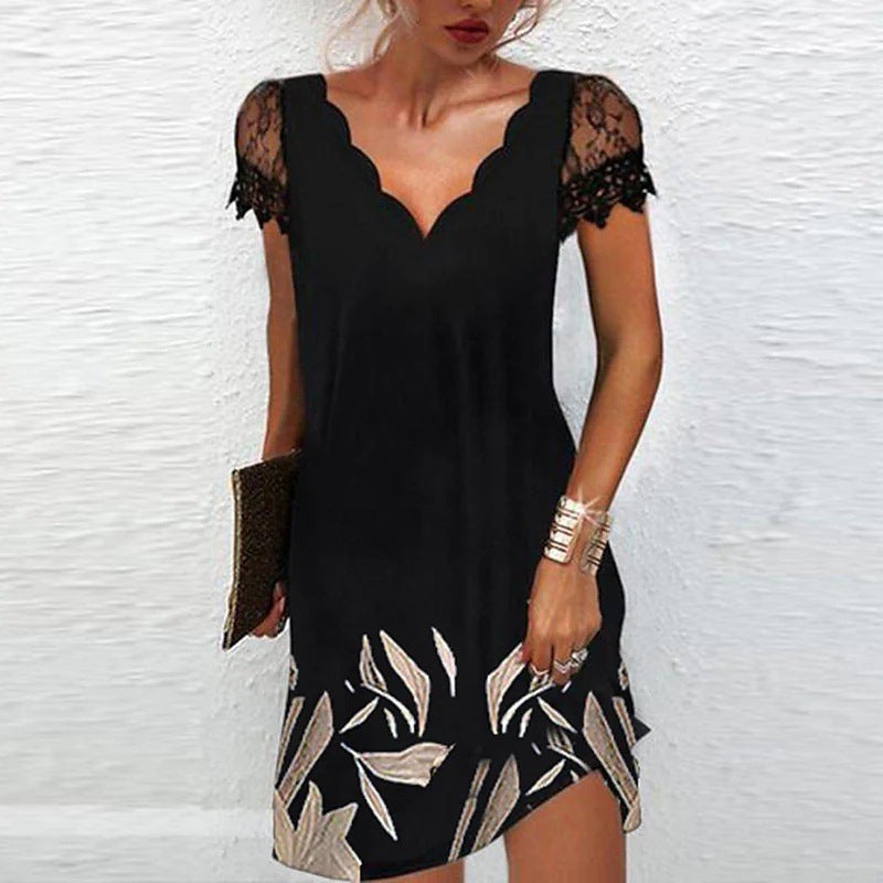 Black lace-trim dress with metallic leaf print detailing at the hem