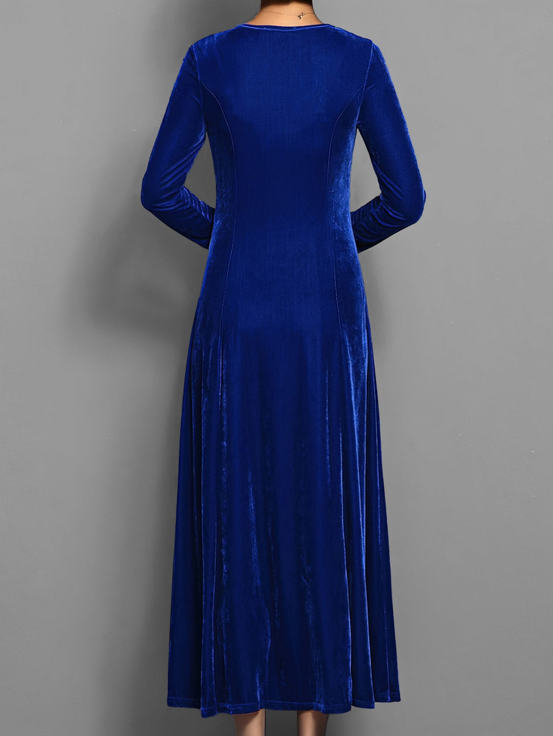 Royal blue velvet maxi dress showing flowing A-line skirt from behind