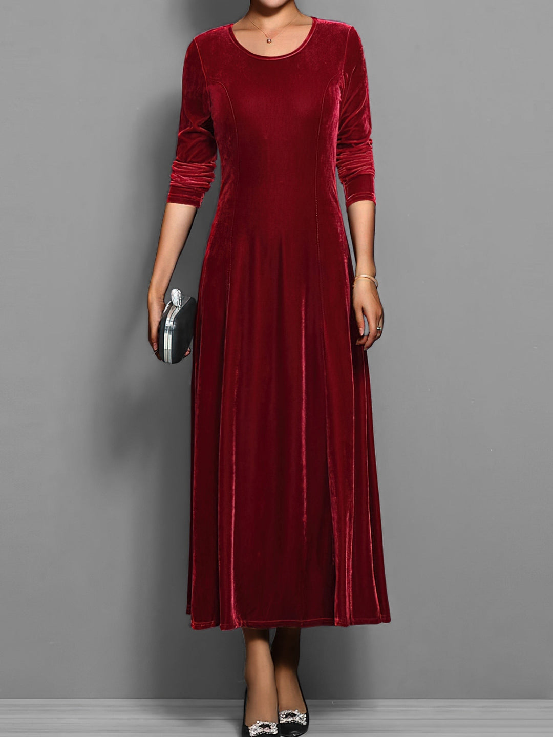 Deep red velvet maxi dress with fitted bodice and long sleeves, front view