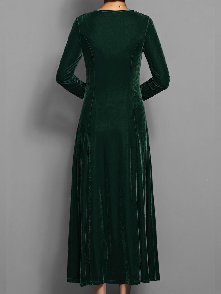 Emerald green velvet maxi dress showing gathered sleeve detail from behind