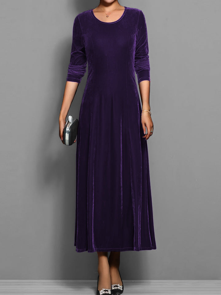 Deep purple velvet maxi dress with fitted waist and long sleeves, front view