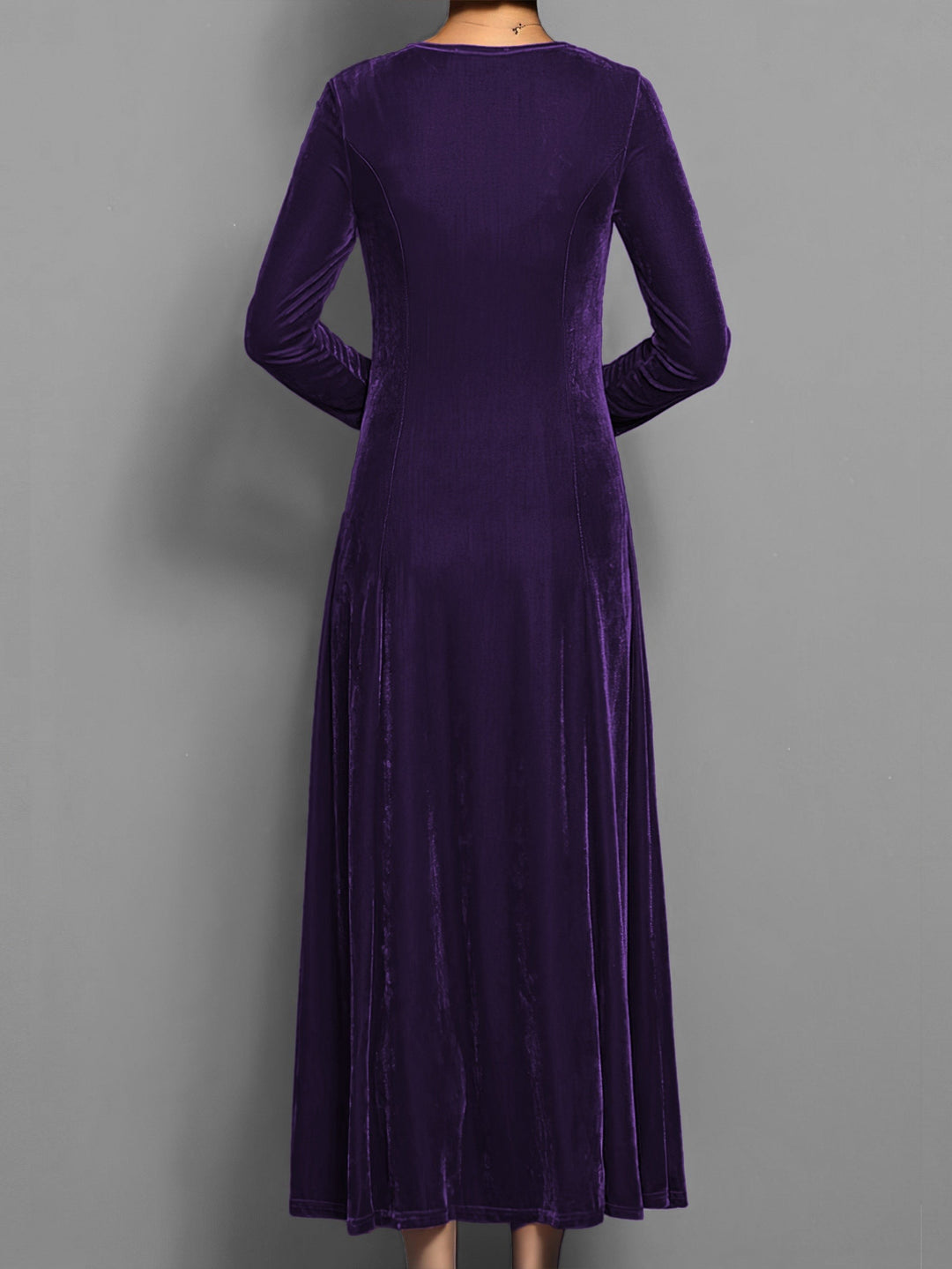 Deep purple velvet maxi dress showing flowing hemline from the back