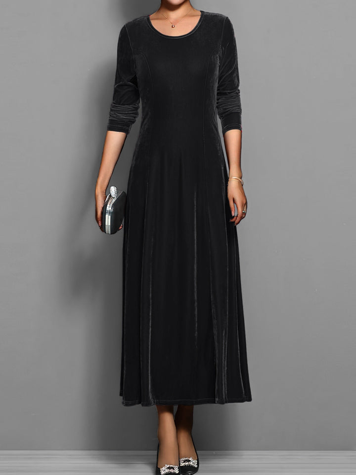 Black velvet maxi dress with long sleeves and round neckline, front view