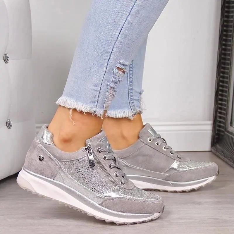 Grey suede zip trainers with sparkly panel worn with cropped jeans