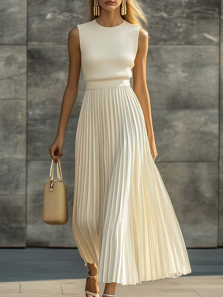 Cream sleeveless knit bodice pleated chiffon maxi dress with flowing skirt