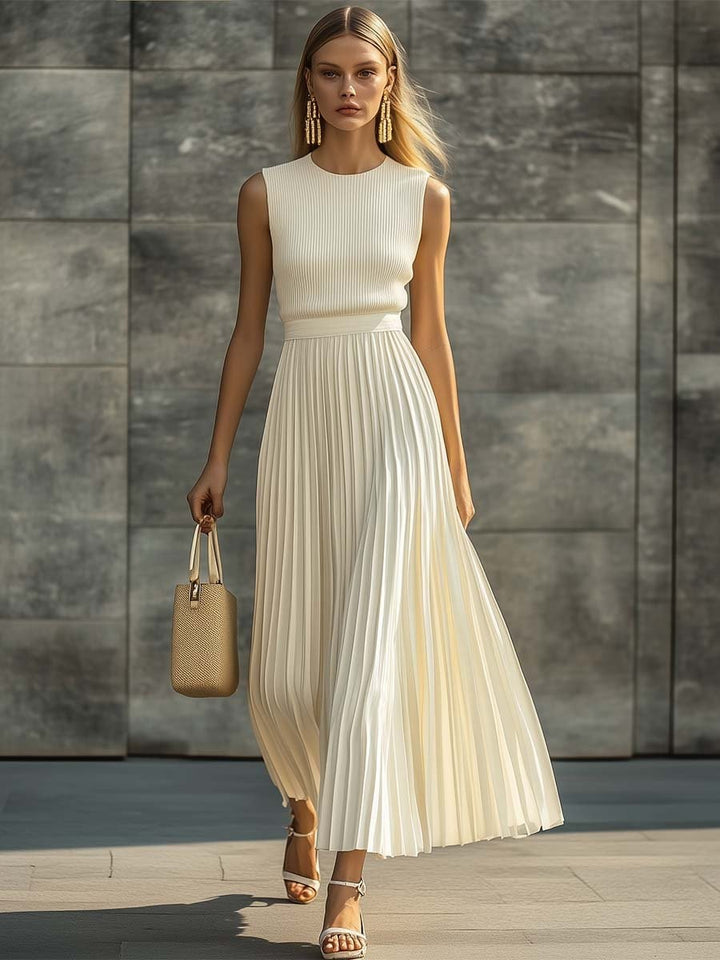 Ivory ribbed knit top pleated maxi dress styled with woven handbag