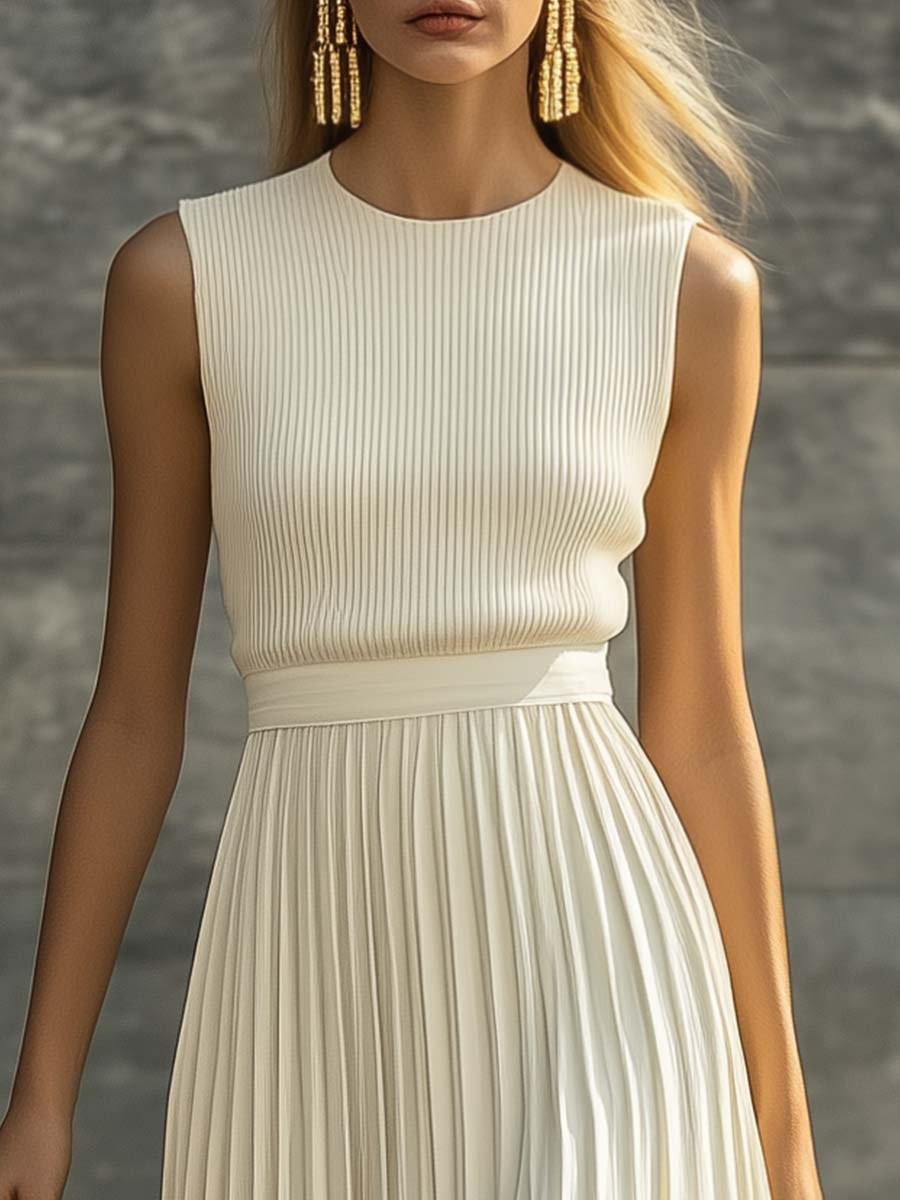 Close-up of ribbed knit sleeveless bodice on cream pleated maxi dress