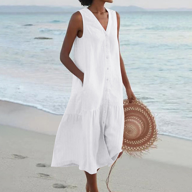 White sleeveless button-through midi dress featuring a relaxed tiered hemline