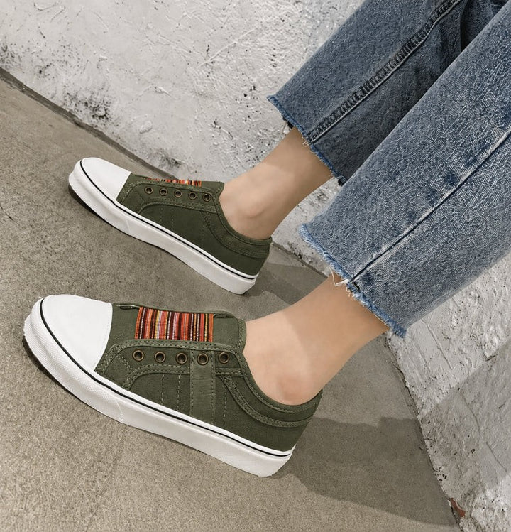 Khaki green canvas slip-on trainers with striped trim and white sole