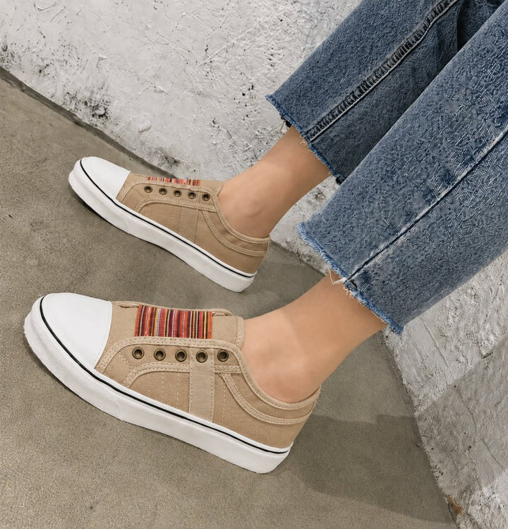 Beige canvas slip-on trainers with woven striped panel and white platform sole