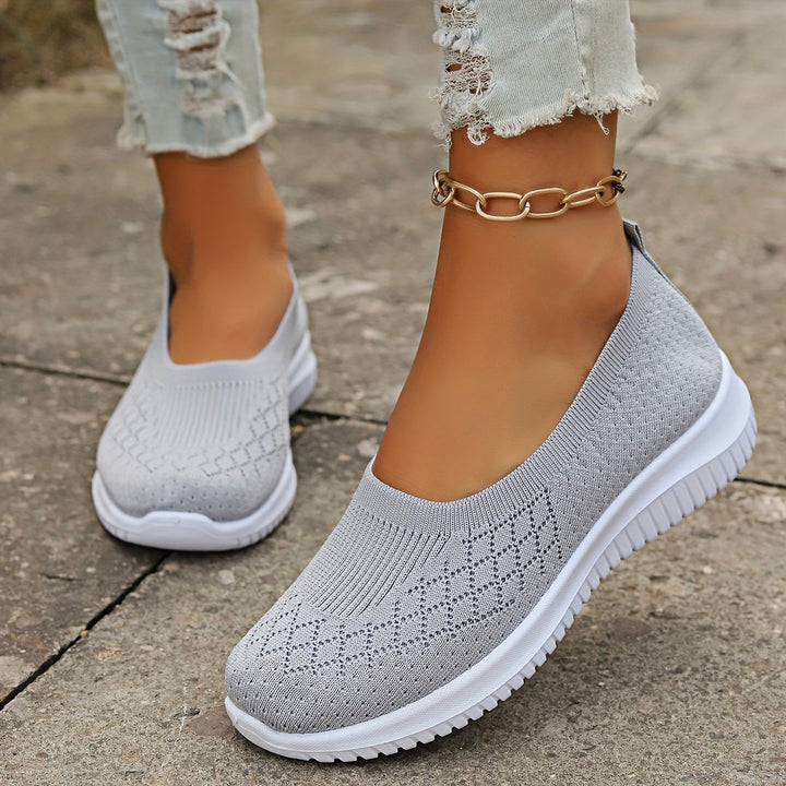 Grey knit slip-on trainers with white soles and diamond mesh detail