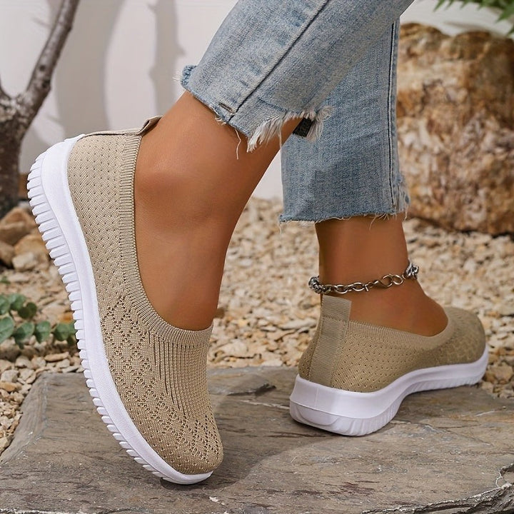 Beige knitted orthopaedic slip-on trainers with cushioned white sole