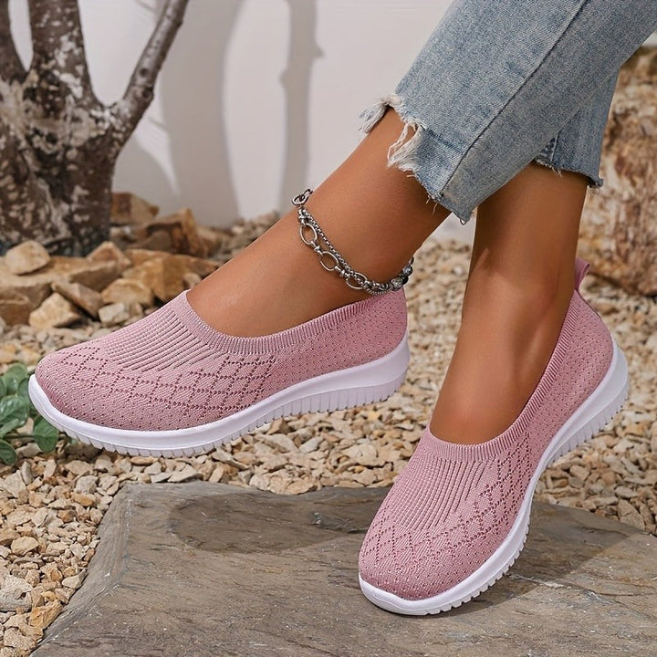 Pink knit slip-on trainers showing soft mesh upper and white sole