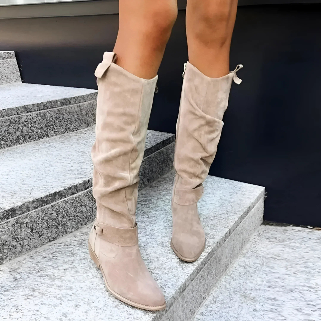 Beige suede knee boots with slouched folds and buckle fastening