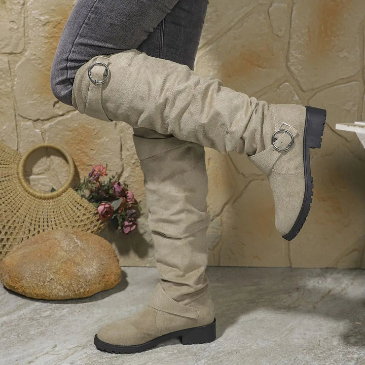 Taupe suede knee-high boots with slouchy finish and chunky rubber sole
